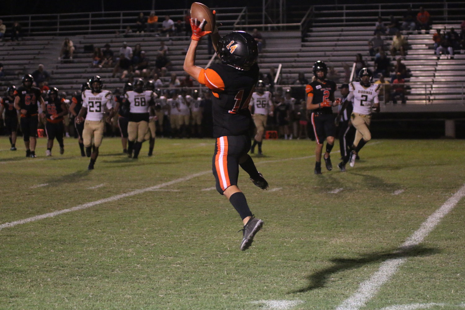 Braden Barfield jumps high to pull down one of his four catches. Barfield also intercepted his sixth pass of the season.