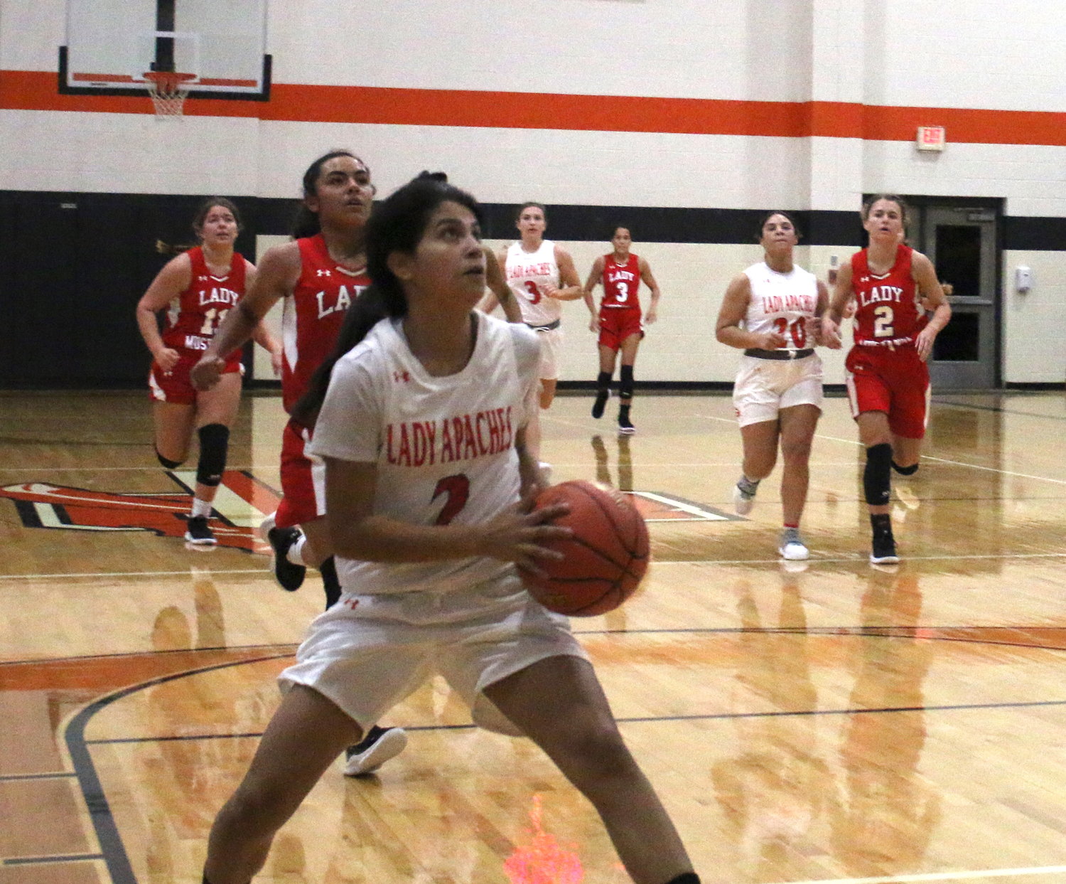 Bella Aguero goes for a layup against Nixon-Smiley in an earlier game this season. Aguero scored eight points against Needville on Tuesday.