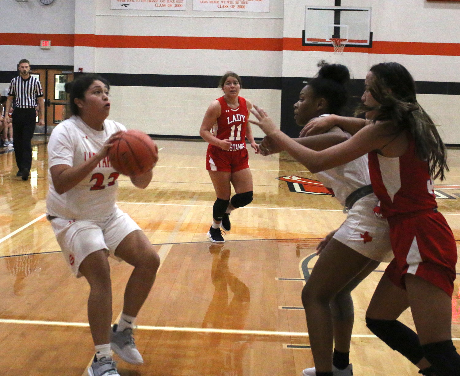 Nancy Nino looks to take a shot with a screen by Niyahna Lowery in an earlier game this season. Nino has been putting in quality minutes for Gonzales.
