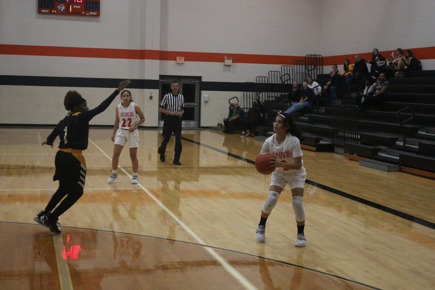 Bella Aguero hits one of her three three-pointers against Sealy. She scored 13 points as Gonzales won, 66-54.