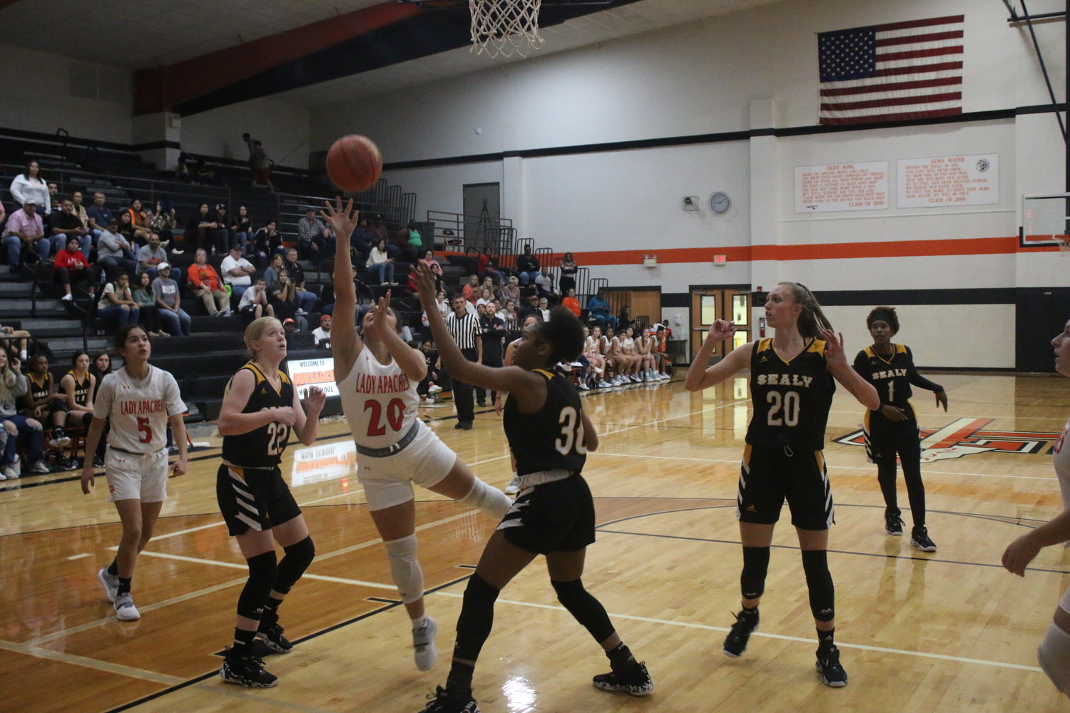 Delaini Seger-Gordon looks to score inside against the paint against the Lady Tigers while Kilee Schwausch looks on.