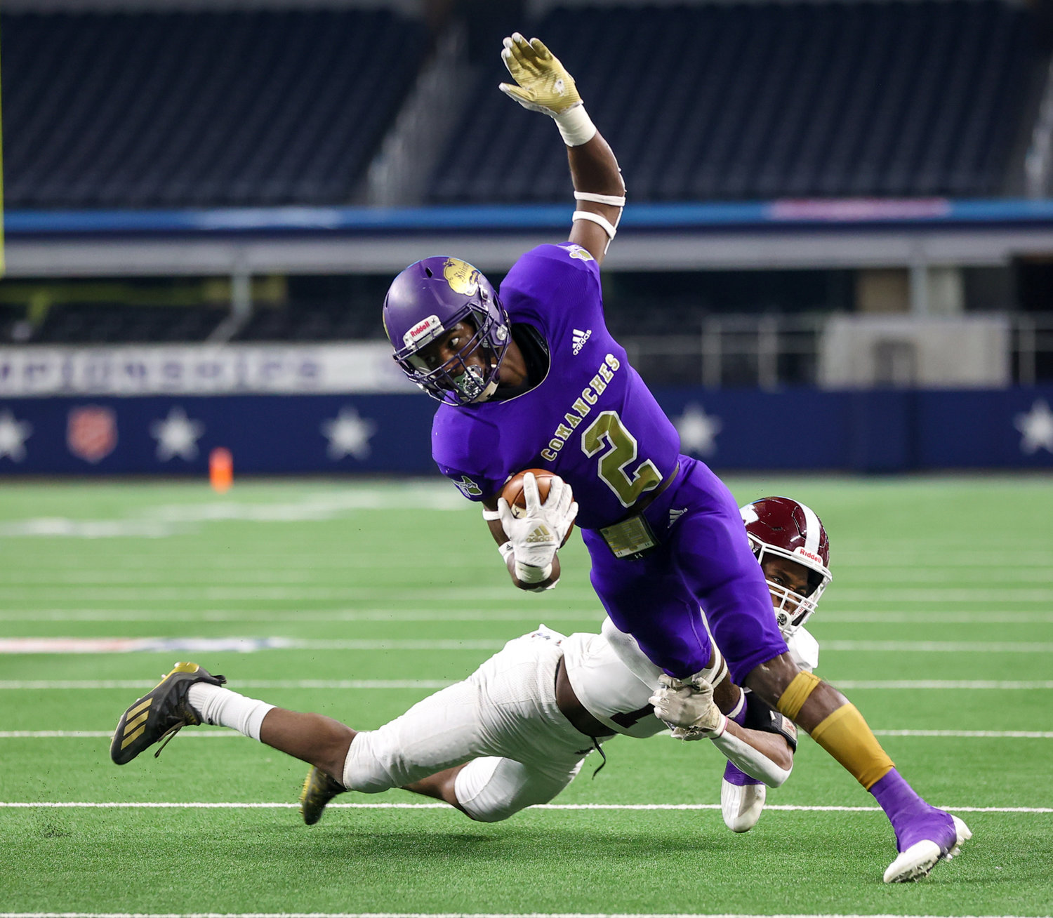 Shiner Comanches junior Dalton Brooks (2) carries the ball during the Class 2A Division I state football championship game between Shiner and Hawley on December 15, 2021 in Arlington, Texas.