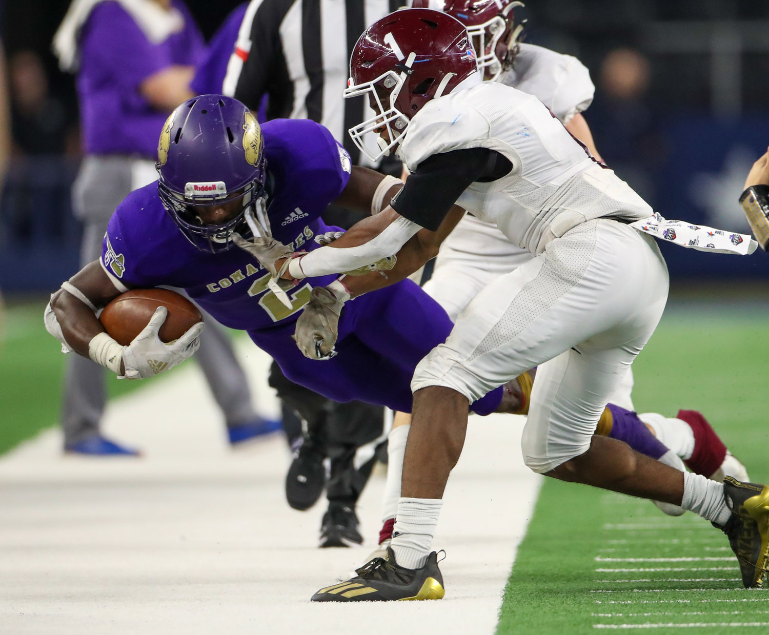 Shiner Comanches junior Dalton Brooks (2) is pushed out of bounds during the Class 2A Division I state football championship game between Shiner and Hawley on December 15, 2021 in Arlington, Texas.