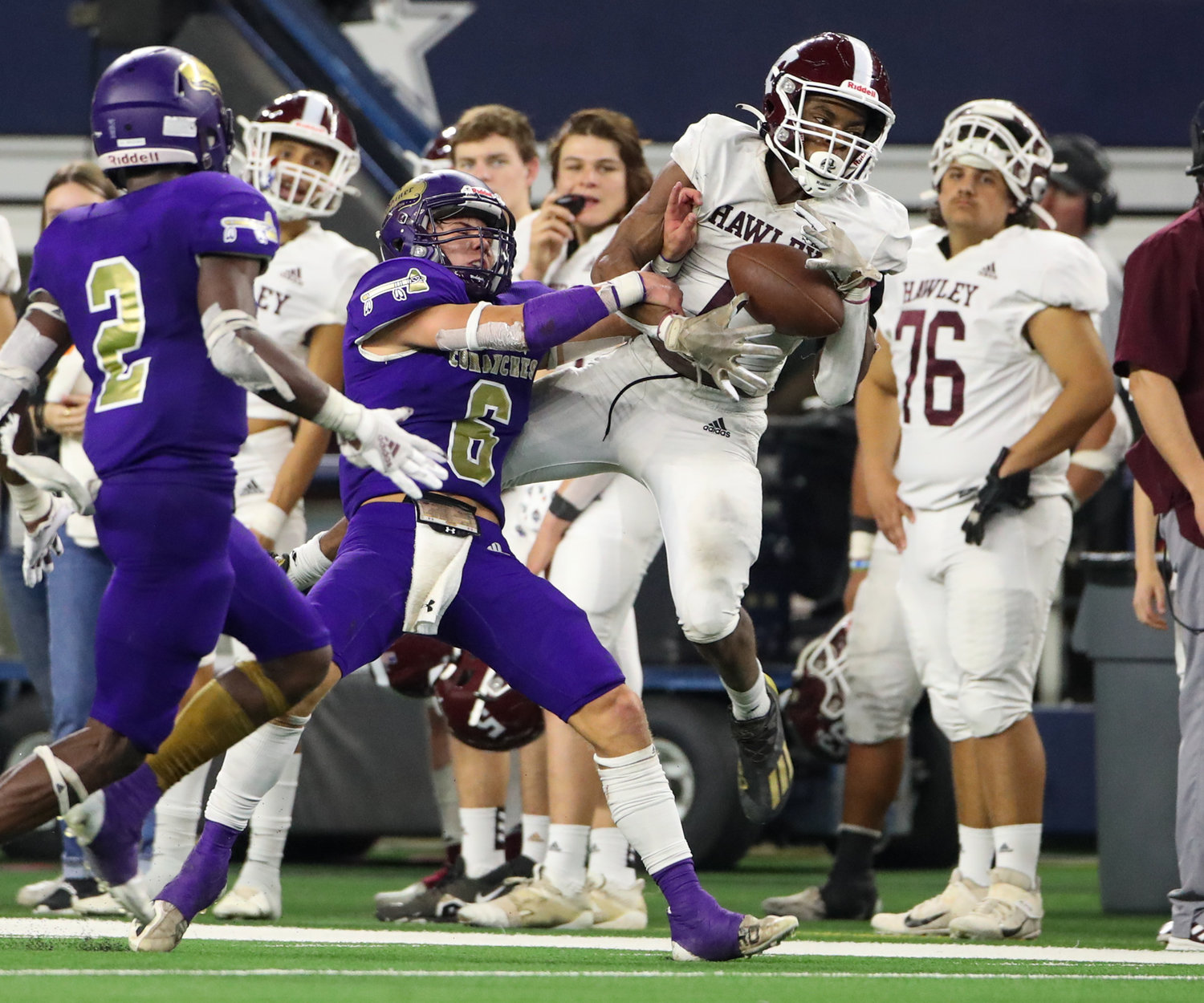 Shiner Comanches junior Drew Wenske (6) breaks up a pass intended for Hawley Bearcats senior Aeneas Segura (1) during the Class 2A Division I state football championship game between Shiner and Hawley on December 15, 2021 in Arlington, Texas.