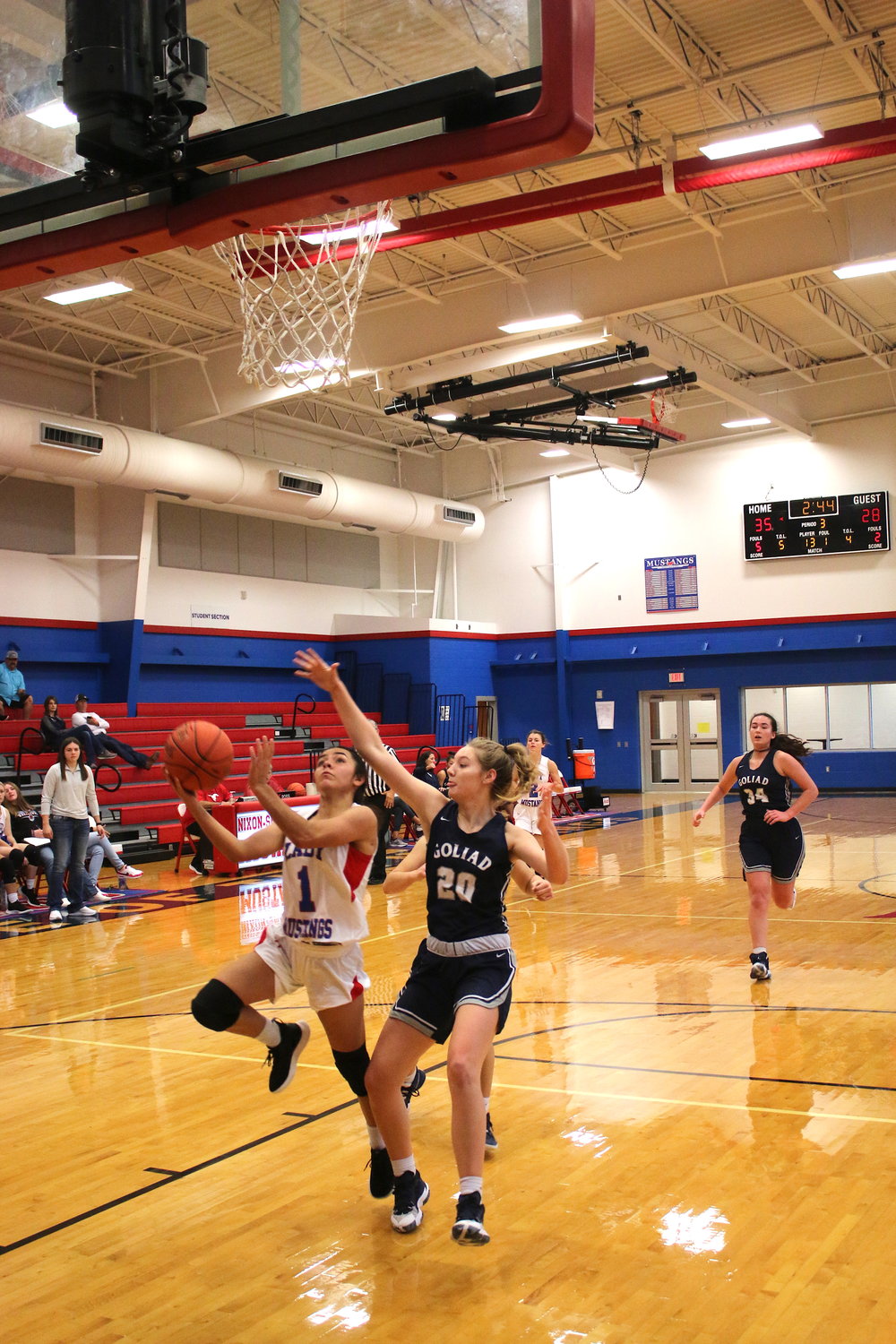 Mady Velasquez makes a layup and gets the foul in the third period of the Lady Mustangs' 48-38 win over Goliad.