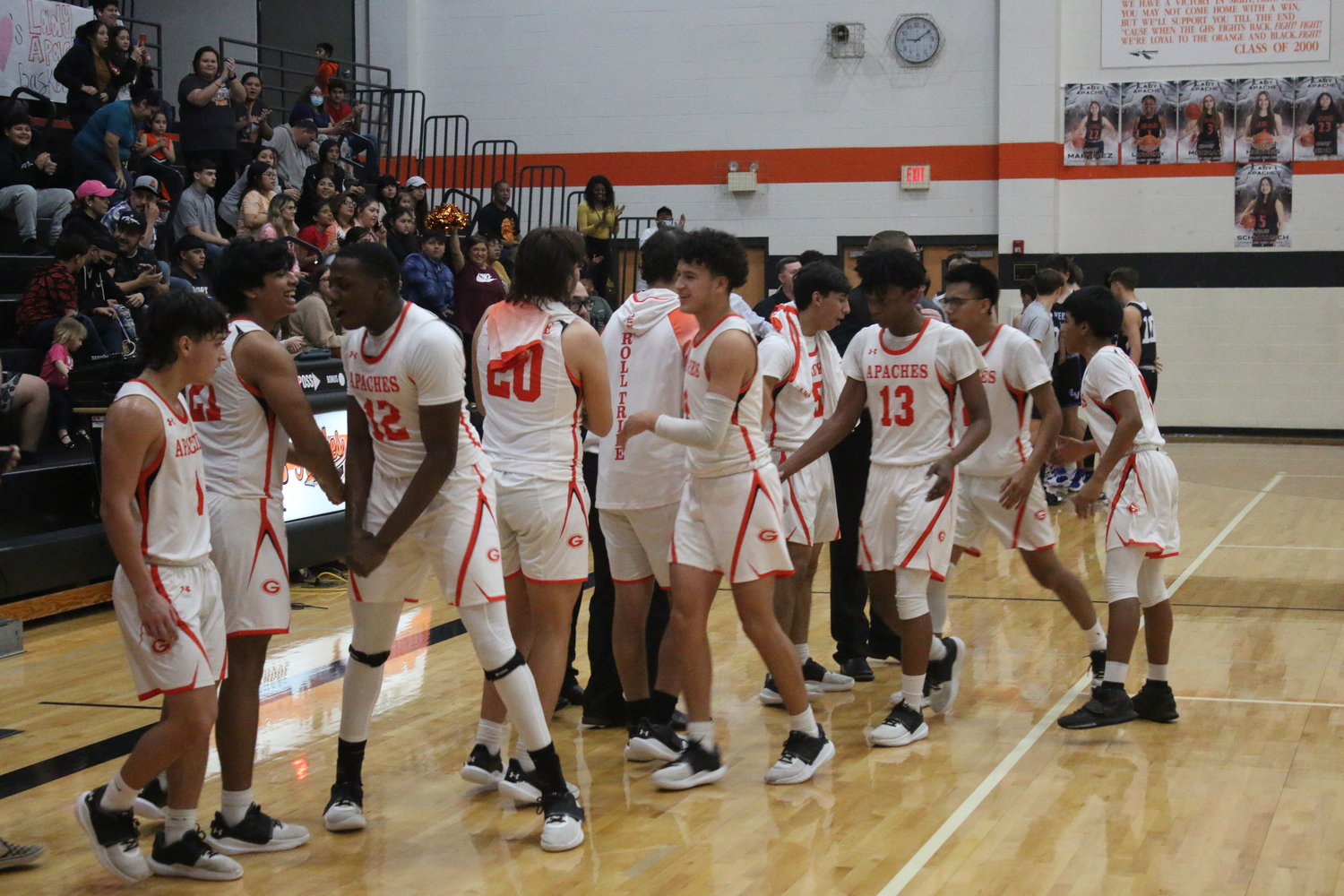 The Gonzales Apaches celebrate an 11-0 run against La Vernia during a recent game. The Apaches are on the brink of clinching a playoff spot.