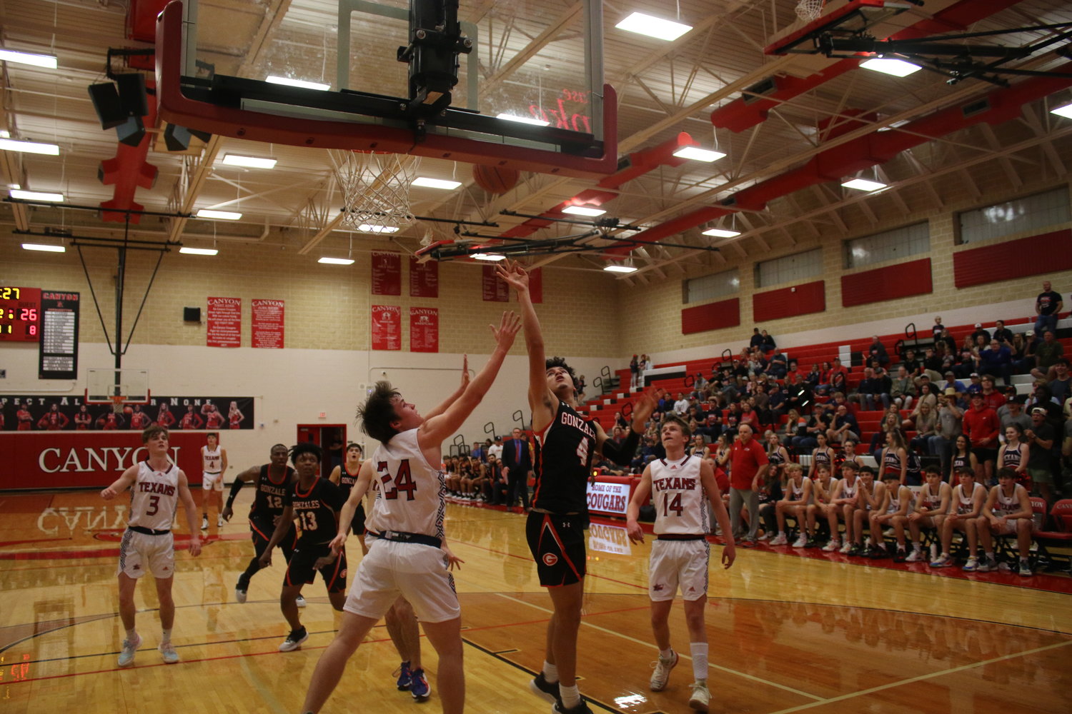 Junior Angel Martinez (4) rebounds and quickly puts it back for two points to tie the game at 28-28 against Wimberley in the bi-district round Tuesday, Feb. 22. Gonzales would lose, 71-65.
