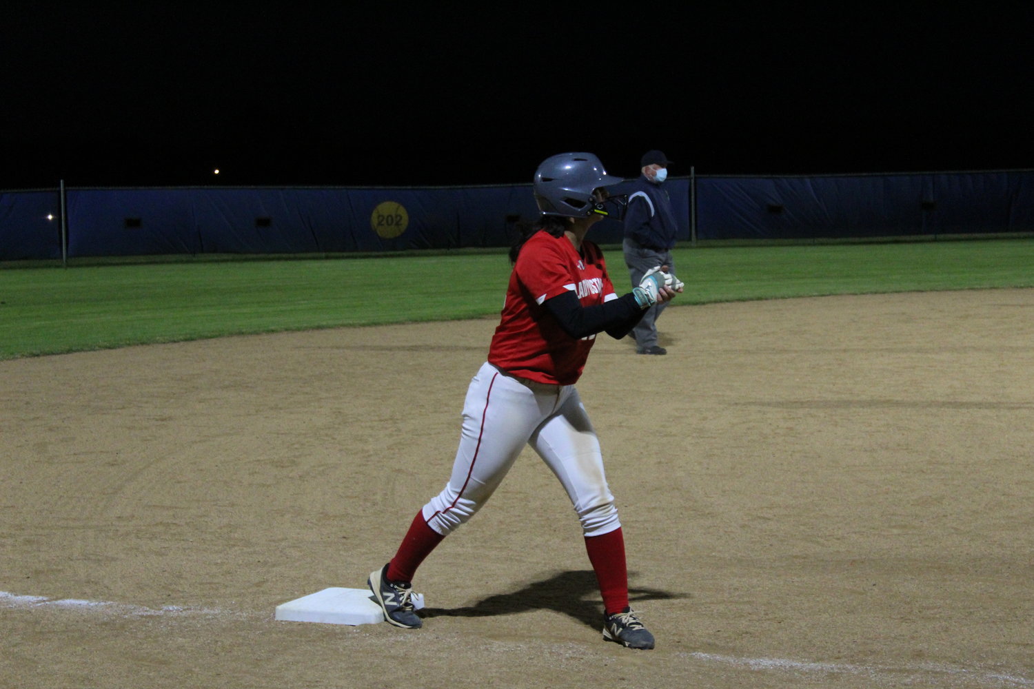 Kendall Amaya takes her lead off third base during Friday night’s game against Gonzales. In addition to her work on the basepaths, Amaya pitched a complete game in the Lady Mustangs’ 21-8 win.