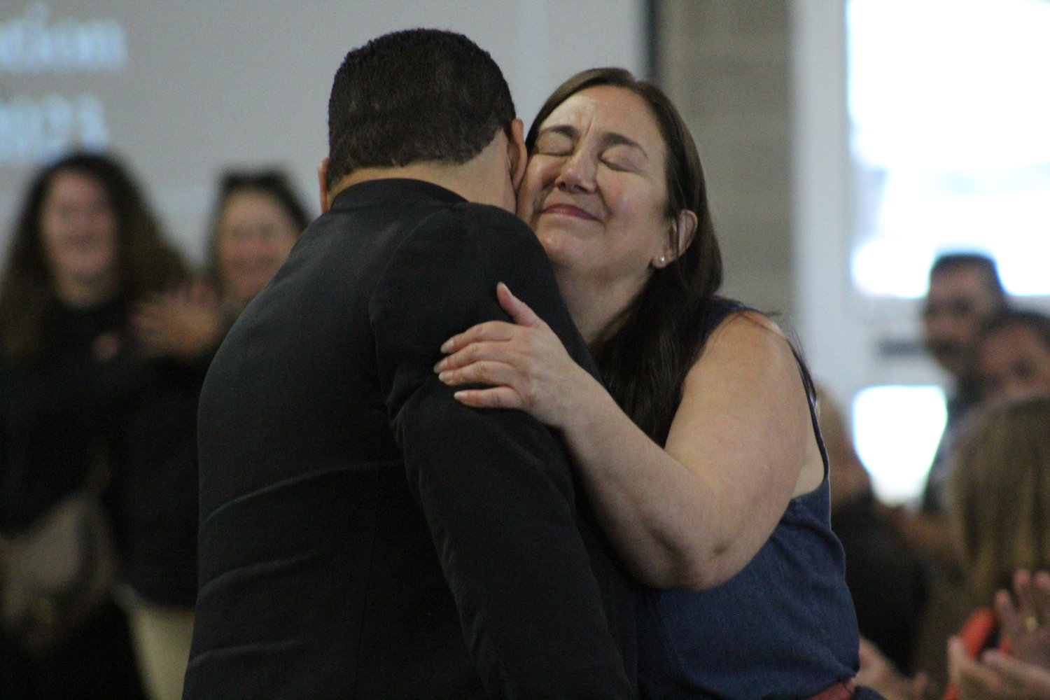 Erin Gruwell hugs GISD Superintendent Elmer Avellaneda after her speech. Gruwell spoke to the GISD teachers and staff the importance of hearing the stories of students.